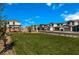 Landscaped community park with green space and shaded pergola surrounded by newly built homes under a clear, sunny sky at 4282 Yucca Brevi Ave, Las Vegas, NV 89139