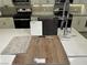 Detailed kitchen design showcasing luxury vinyl plank flooring, neutral quartz countertop, stainless steel appliances and stylish cabinetry at 4282 Yucca Brevi Ave, Las Vegas, NV 89139