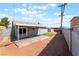 Large backyard with patio, gravel and artificial turf at 4857 Fairfax Ave, Las Vegas, NV 89120
