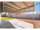 Backyard boasts a covered patio, a rock yard and a small patch of artifical turf at 4857 Fairfax Ave, Las Vegas, NV 89120
