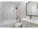 Modern bathroom with white marble tile, a sleek vanity, and matte black fixtures at 4857 Fairfax Ave, Las Vegas, NV 89120