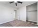 Bedroom showcases a ceiling fan, neutral decor and a closet at 4857 Fairfax Ave, Las Vegas, NV 89120