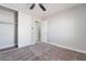 The bedroom boasts a closet, neutral paint and a ceiling fan at 4857 Fairfax Ave, Las Vegas, NV 89120