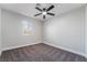 Bedroom features a ceiling fan, neutral decor, and window for natural light at 4857 Fairfax Ave, Las Vegas, NV 89120