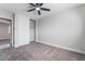 Bedroom with gray carpet and a white sliding-door closet at 4857 Fairfax Ave, Las Vegas, NV 89120