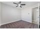 Neutral bedroom features a ceiling fan and doorway to the ensuite bathroom at 4857 Fairfax Ave, Las Vegas, NV 89120