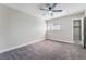 Spacious bedroom features a ceiling fan, neutral decor, and an ample closet at 4857 Fairfax Ave, Las Vegas, NV 89120