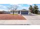 Charming single-story home featuring gray paint, desert landscaping, and a two-car garage at 4857 Fairfax Ave, Las Vegas, NV 89120