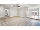Open living room features modern ceiling fan and view to the kitchen at 4857 Fairfax Ave, Las Vegas, NV 89120