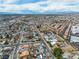 Great aerial view of a residential neighborhood with street views, palm trees, and city skyline at 5050 Secret Rock St, Las Vegas, NV 89122