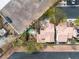 Aerial view of two homes with a shared pool and landscaping, showcasing their layout and neighborhood at 5050 Secret Rock St, Las Vegas, NV 89122
