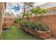 Backyard features decorative landscaping and artificial grass at 5050 Secret Rock St, Las Vegas, NV 89122
