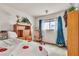 Cozy bedroom with a rocking chair and natural light from a window at 5050 Secret Rock St, Las Vegas, NV 89122