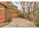 Attached one-car garage with a private drive and drought tolerant desert landscaping at 5050 Secret Rock St, Las Vegas, NV 89122