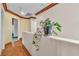 Second-floor hallway with wooden floors and decorative planter at 5050 Secret Rock St, Las Vegas, NV 89122