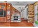 Open living room with hardwood floors, a fireplace, and a view to the staircase at 5050 Secret Rock St, Las Vegas, NV 89122