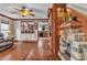 Living room with hardwood floors, a fireplace, and access to the kitchen via a pass-through at 5050 Secret Rock St, Las Vegas, NV 89122