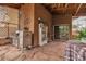 Outdoor patio area with a built-in grill, a smoker, and a covered dining space at 5050 Secret Rock St, Las Vegas, NV 89122