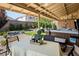 Relaxing backyard patio features a covered area, hot tub, and beautifully landscaped garden with decorative rocks and plants at 5317 Clover Blossom Ct, North Las Vegas, NV 89031