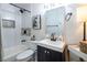 This bathroom features a vanity with sink, mirror, shower, and bath at 5317 Clover Blossom Ct, North Las Vegas, NV 89031