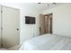 This bedroom features a ceiling fan, closet, and mounted TV at 5317 Clover Blossom Ct, North Las Vegas, NV 89031