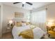 Cozy bedroom featuring a ceiling fan, large windows, and plenty of natural light at 5317 Clover Blossom Ct, North Las Vegas, NV 89031
