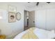 Bedroom with closet, art, ceiling fan and adjacent bath area at 5317 Clover Blossom Ct, North Las Vegas, NV 89031