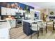Modern kitchen features stainless steel appliances, breakfast bar, and stylish decor at 5317 Clover Blossom Ct, North Las Vegas, NV 89031