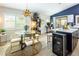 Bright dining area adjacent to a modern kitchen, perfect for entertaining with seamless indoor-outdoor living at 5317 Clover Blossom Ct, North Las Vegas, NV 89031