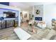 Bright living room boasts a decorative fireplace, modern decor, and spacious open layout with natural lighting at 5317 Clover Blossom Ct, North Las Vegas, NV 89031