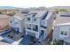 New home featuring solar panels, a balcony, a two-car garage, and a desert landscape in a Primary-planned community at 5745 Becklow Gardens Ave, Las Vegas, NV 89141