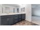 Bathroom featuring double sinks, generous counter space, and stylish cabinets at 5745 Becklow Gardens Ave, Las Vegas, NV 89141