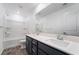 A bathroom with a double sink vanity and a shower-tub combo at 5745 Becklow Gardens Ave, Las Vegas, NV 89141