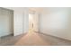 A bright bedroom with sliding closet doors and neutral carpeting at 5745 Becklow Gardens Ave, Las Vegas, NV 89141