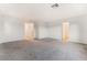 Spacious bedroom with neutral carpet and access to a bathroom and closet at 5745 Becklow Gardens Ave, Las Vegas, NV 89141