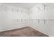 Walk-in closet featuring ample shelving and neutral carpet at 5745 Becklow Gardens Ave, Las Vegas, NV 89141