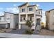 Modern home featuring a two-story facade, private balcony, and a paved driveway for curb appeal at 5745 Becklow Gardens Ave, Las Vegas, NV 89141