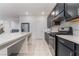 Open kitchen area with a large center island, stainless steel appliances, and seamless transition to dining at 5745 Becklow Gardens Ave, Las Vegas, NV 89141