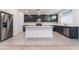 Spacious kitchen with stainless steel appliances, a center island, and dark cabinetry, perfect for cooking at 5745 Becklow Gardens Ave, Las Vegas, NV 89141