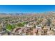 An aerial view of a residential neighborhood with mountain views on the horizon at 605 Bachelor Button St, Las Vegas, NV 89138