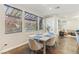 Inviting dining area featuring a modern table set, three light-filled windows and tile flooring at 605 Bachelor Button St, Las Vegas, NV 89138