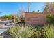 The community entrance with a Mariposa sign, lush landscaping, and stone pillars at 605 Bachelor Button St, Las Vegas, NV 89138