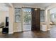 Open living area with slate tile flooring, sliding glass door, and plantation shutters at 605 Bachelor Button St, Las Vegas, NV 89138