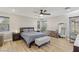 Tranquil main bedroom with a comfortable bed, warm wood floors and abundant natural light at 605 Bachelor Button St, Las Vegas, NV 89138