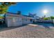 The backyard is graveled with a small concrete patio, and surrounded by a tall block wall, providing privacy at 6248 Spanish Moss Ave, Las Vegas, NV 89108