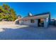 Spacious backyard area with gravel, a patio, and blue skies above at 6248 Spanish Moss Ave, Las Vegas, NV 89108