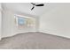 Bedroom featuring a bay window, ceiling fan, and carpet at 6248 Spanish Moss Ave, Las Vegas, NV 89108