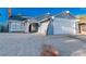 Charming single-story home with desert landscaping and an attached two-car garage at 6248 Spanish Moss Ave, Las Vegas, NV 89108
