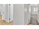 Hallway featuring two different rooms, separated by a closed door at 6248 Spanish Moss Ave, Las Vegas, NV 89108