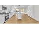Bright kitchen with white cabinets, a large island, and backyard access at 6248 Spanish Moss Ave, Las Vegas, NV 89108